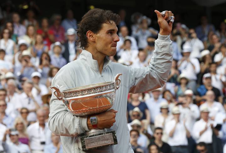 Rafael Nadal of Spain holds the trophy during the ceremony after defeating Novak Djokovic of Serbia during their men's singles final match to win the French Open Tennis tournament in Paris